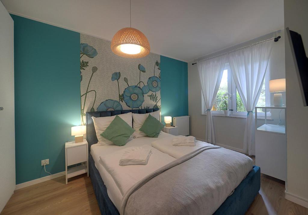 Posteľ alebo postele v izbe v ubytovaní Trevilles Apartamenty Pogodny