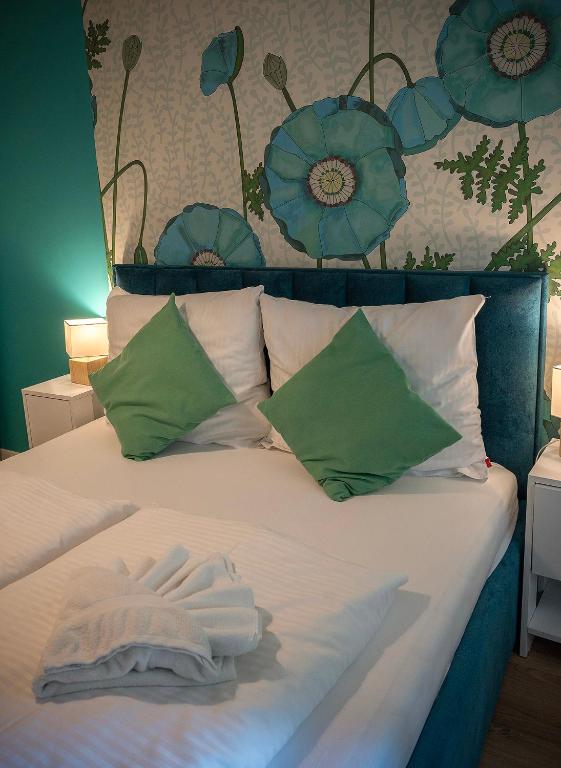 Posteľ alebo postele v izbe v ubytovaní Trevilles Apartamenty Pogodny