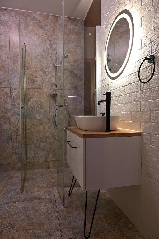Kúpeľňa v ubytovaní Trevilles Apartamenty Pogodny