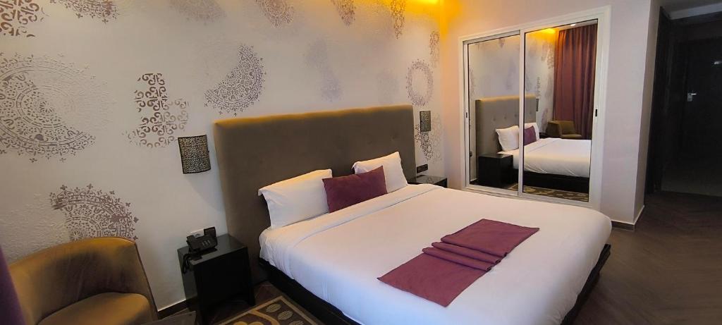 Postel nebo postele na pokoji v ubytování Hotel Swani