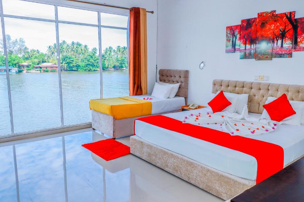 Postel nebo postele na pokoji v ubytování Amber House Lanka