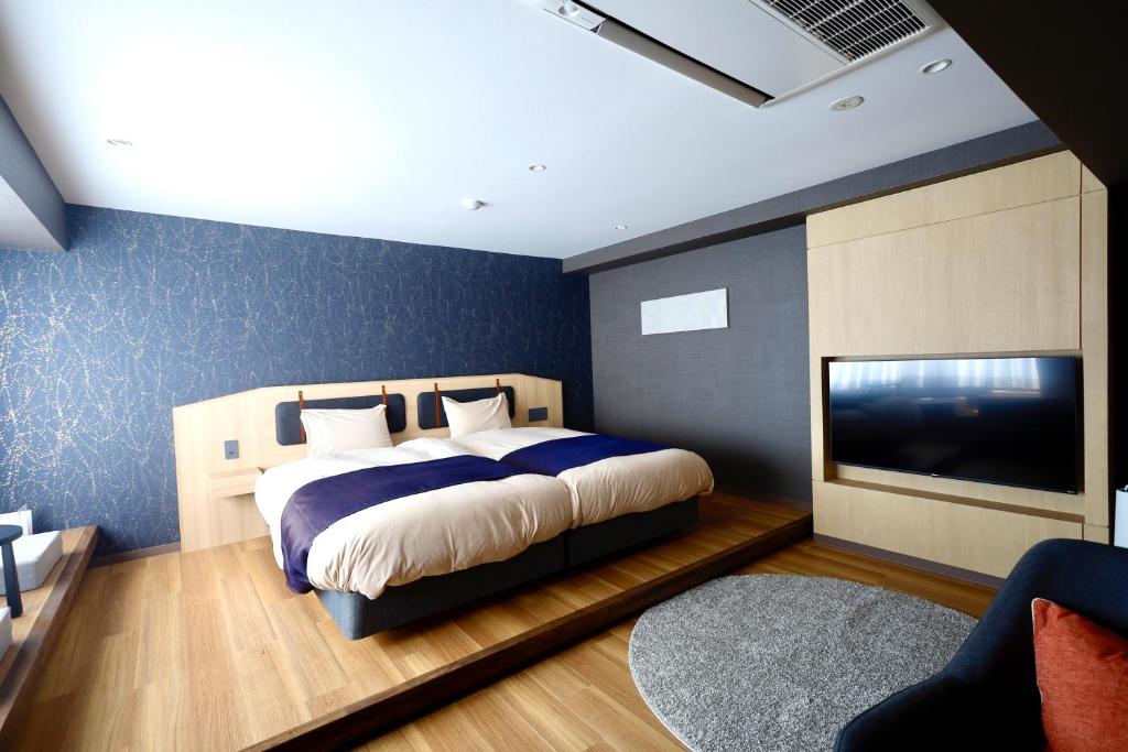 Postel nebo postele na pokoji v ubytování Kyoto Pleasant Hotel