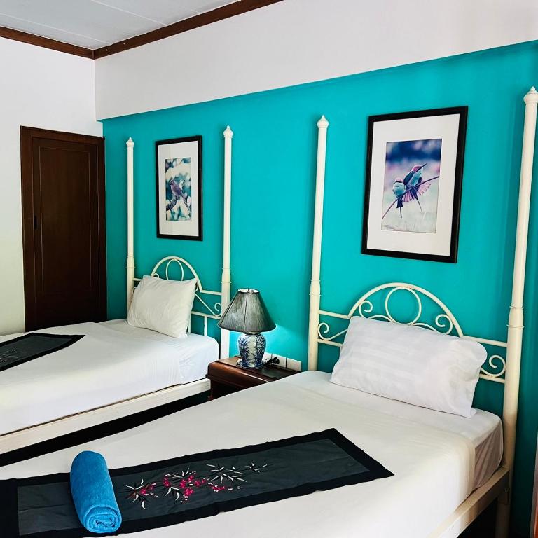 Postel nebo postele na pokoji v ubytování Successive Resort ,Krabi