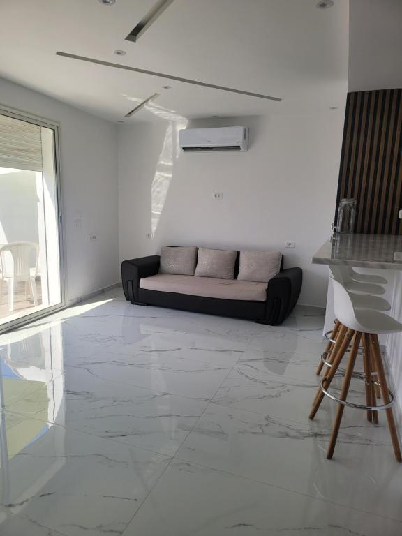 Posezení v ubytování Appartement avec piscine vue sur mer