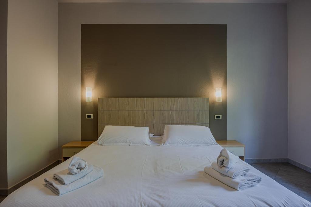 Postel nebo postele na pokoji v ubytování Residence San Michele