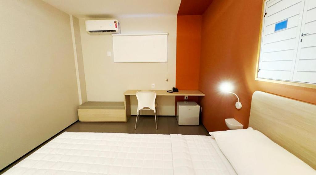 Postel nebo postele na pokoji v ubytování Hotel São Domingos