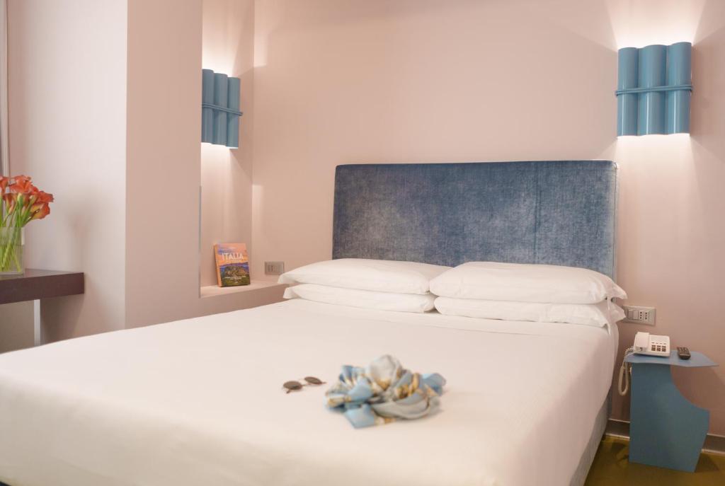 Postel nebo postele na pokoji v ubytování Moderno Hotel Roma