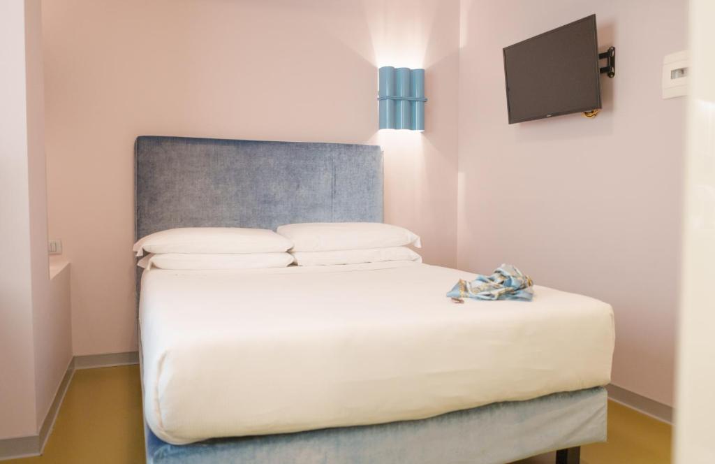 Postel nebo postele na pokoji v ubytování Moderno Hotel Roma
