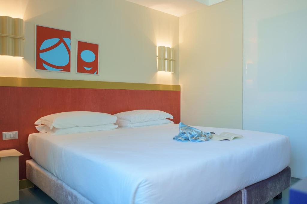Postel nebo postele na pokoji v ubytování Moderno Hotel Roma