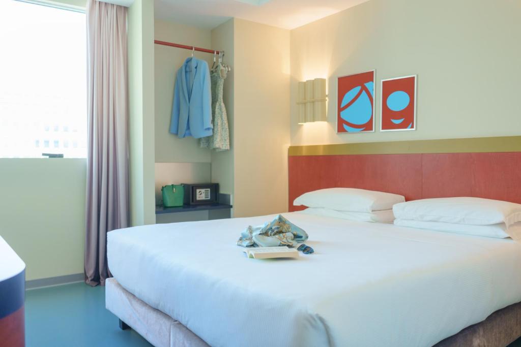 Postel nebo postele na pokoji v ubytování Moderno Hotel Roma