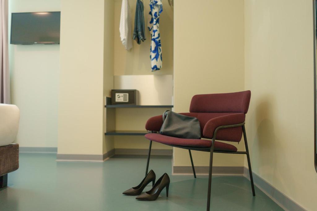 TV a/nebo společenská místnost v ubytování Moderno Hotel Roma