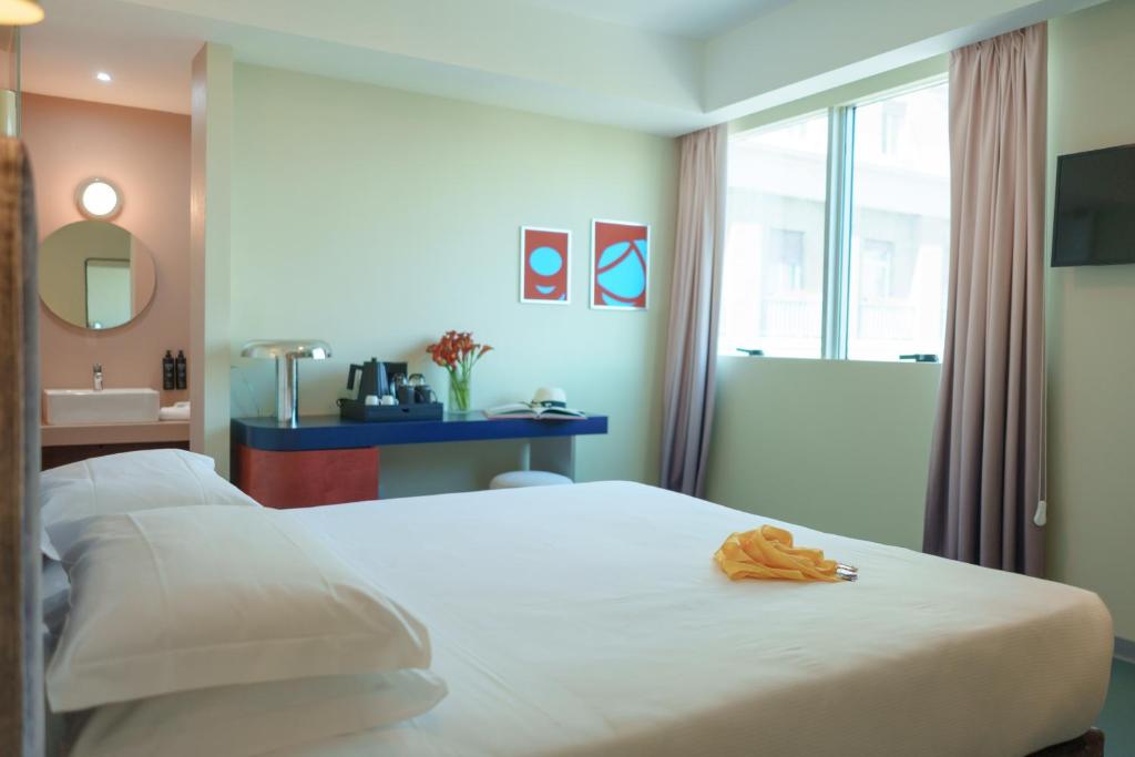 Postel nebo postele na pokoji v ubytování Moderno Hotel Roma