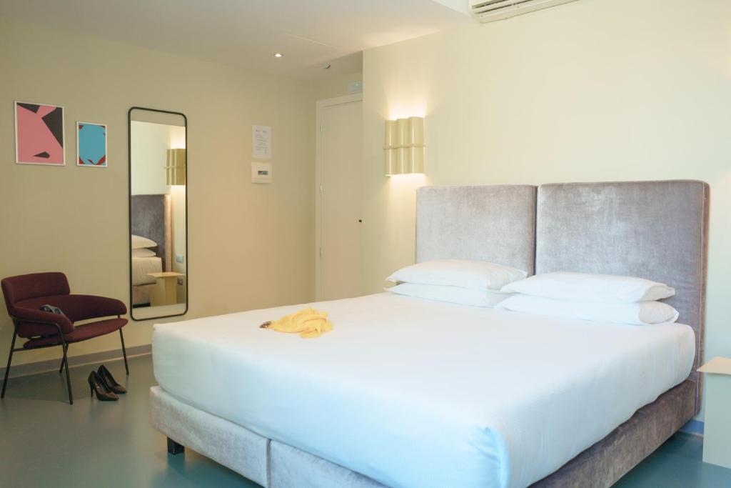 Postel nebo postele na pokoji v ubytování Moderno Hotel Roma