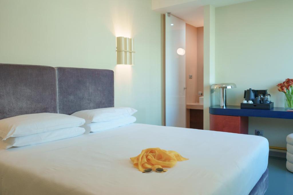Postel nebo postele na pokoji v ubytování Moderno Hotel Roma