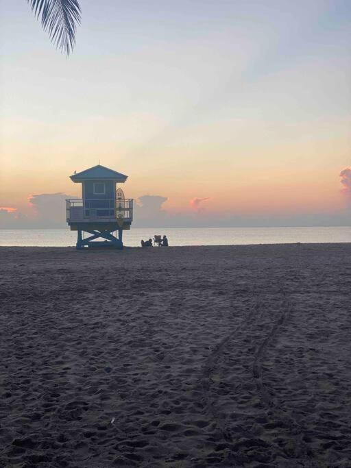 a life guard shack on the beach at sunset at Hollywood Townhouse steps to beach and famous Broadwalk in Hollywood Beach