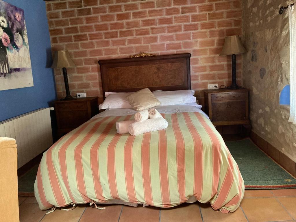 Postel nebo postele na pokoji v ubytování Casa Gallinera