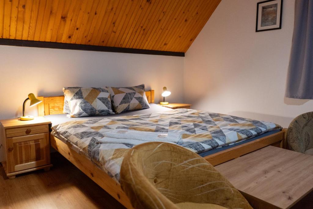 Postel nebo postele na pokoji v ubytování Penzion Jas