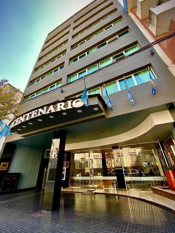 a building with a sign on the front of it at Hotel Bicentenario Suites &amp; Spa in San Miguel de Tucumán