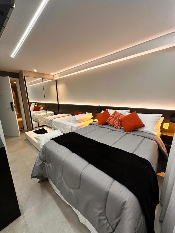 a large bedroom with two beds in it at RN STUDIO PREMIUM Ap 321 in Maceió