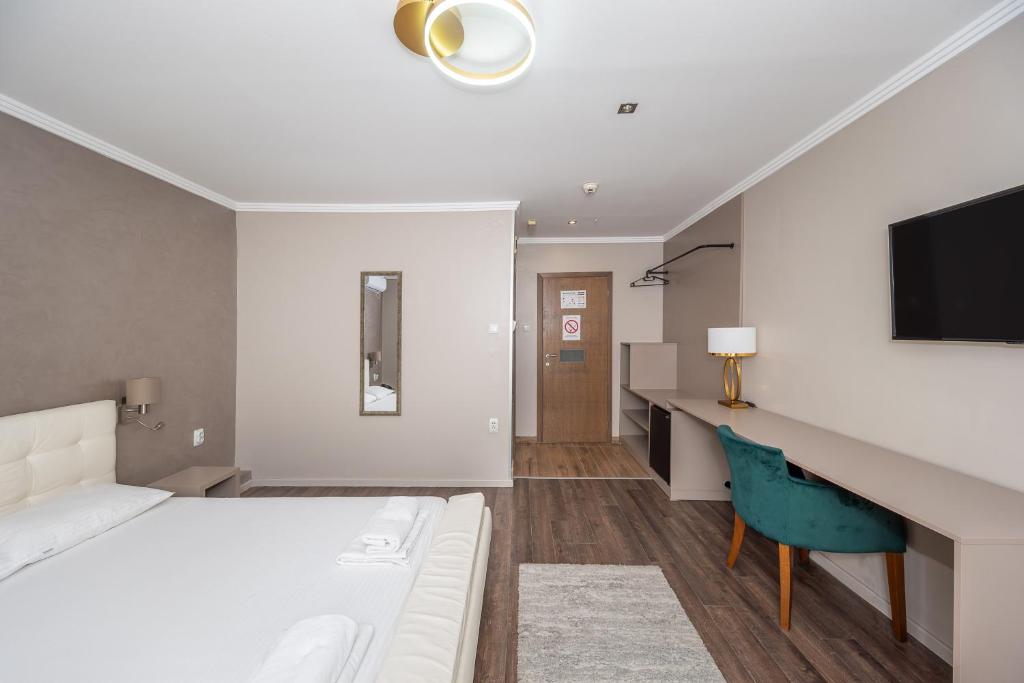 Letto o letti in una camera di Garni Hotel Mediteraneo