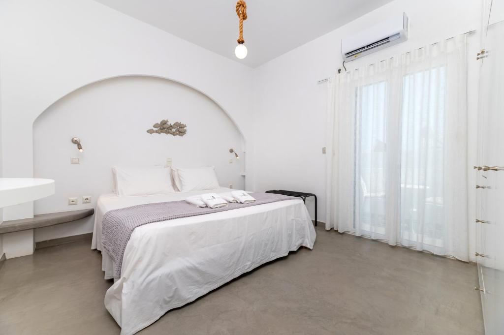 Postel nebo postele na pokoji v ubytování AquaLung Suites