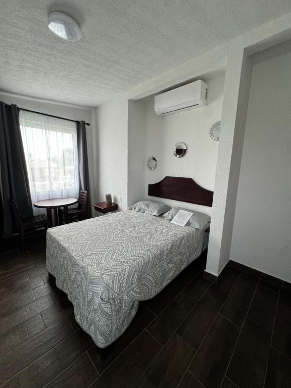 Postel nebo postele na pokoji v ubytování Ananta Hotel
