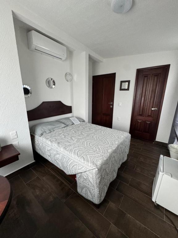 Postel nebo postele na pokoji v ubytování Ananta Hotel