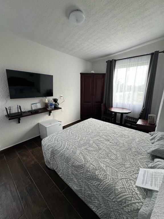 Postel nebo postele na pokoji v ubytování Ananta Hotel