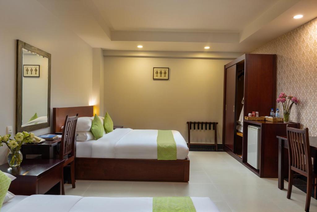 Postel nebo postele na pokoji v ubytování Skyline Boutique Hotel