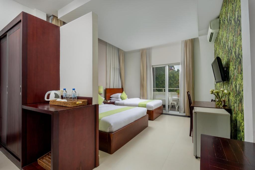 Postel nebo postele na pokoji v ubytování Skyline Boutique Hotel