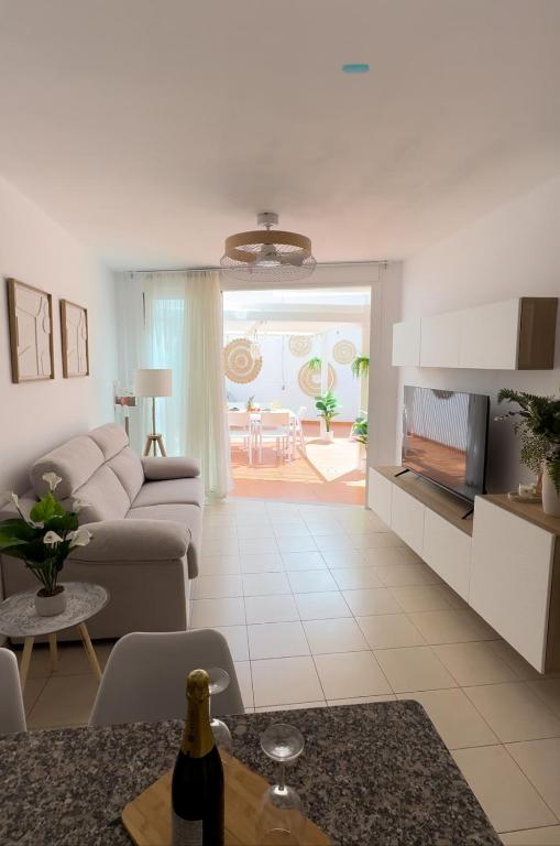 a living room with a couch and a table at Vamos Tenerife - Playa La Arena - Puerto De Santiago in Puerto de Santiago