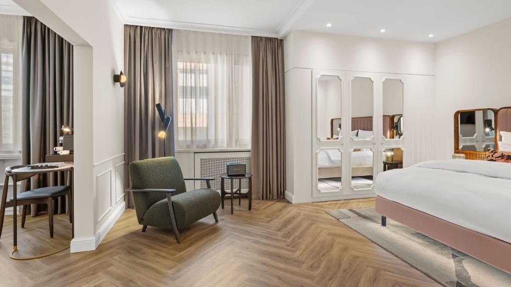 Postel nebo postele na pokoji v ubytování Hotel Bristol Berlin