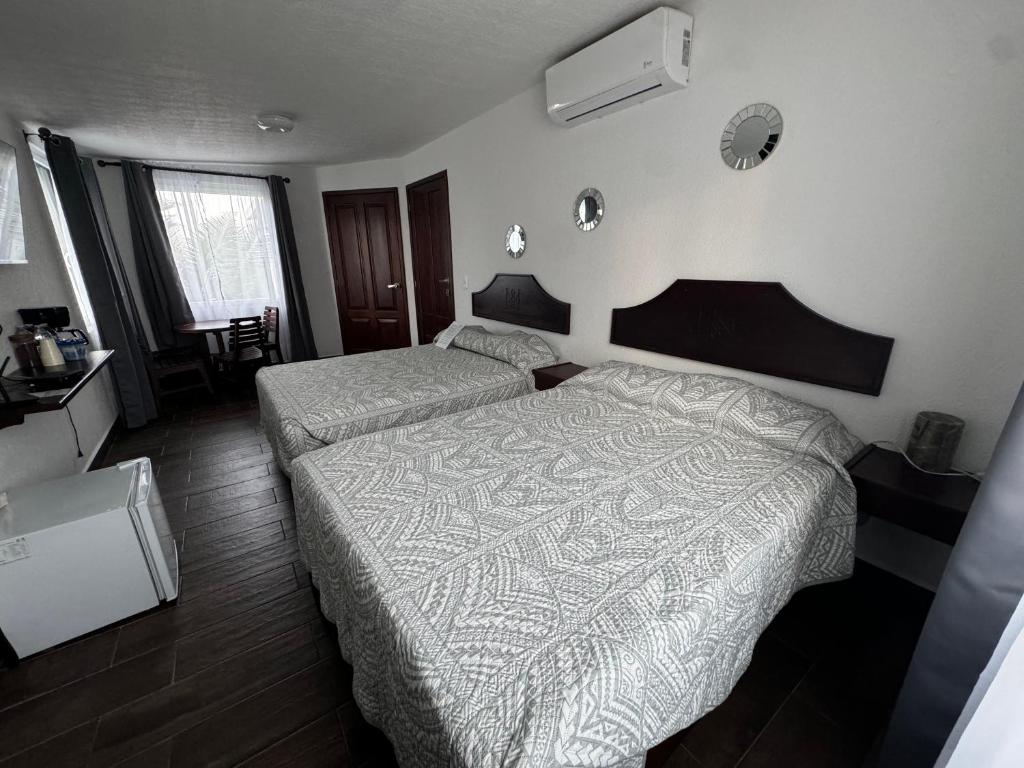 Postel nebo postele na pokoji v ubytování Ananta Hotel