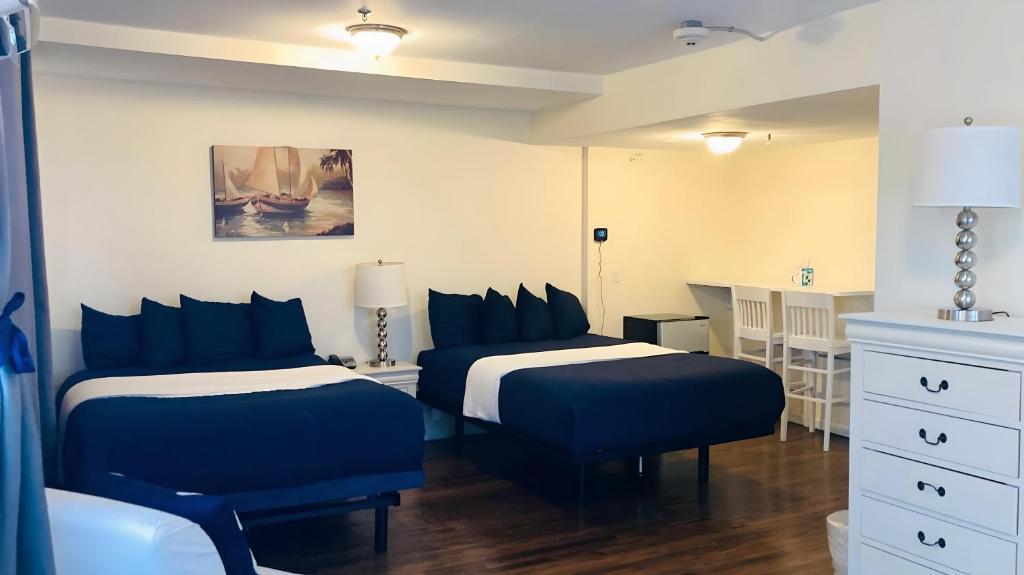 Postel nebo postele na pokoji v ubytování Long Beach Hotel