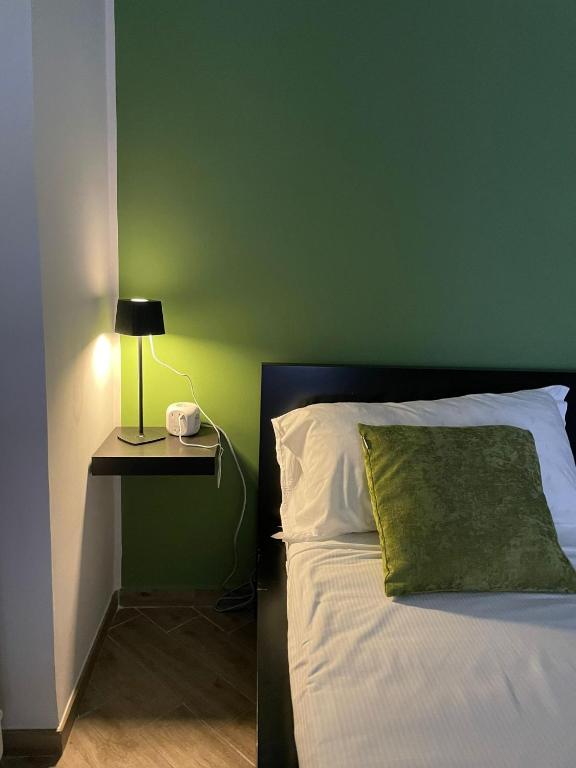 Postel nebo postele na pokoji v ubytování Policlinico Room