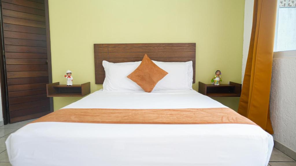 Postel nebo postele na pokoji v ubytování Hotel del Parque
