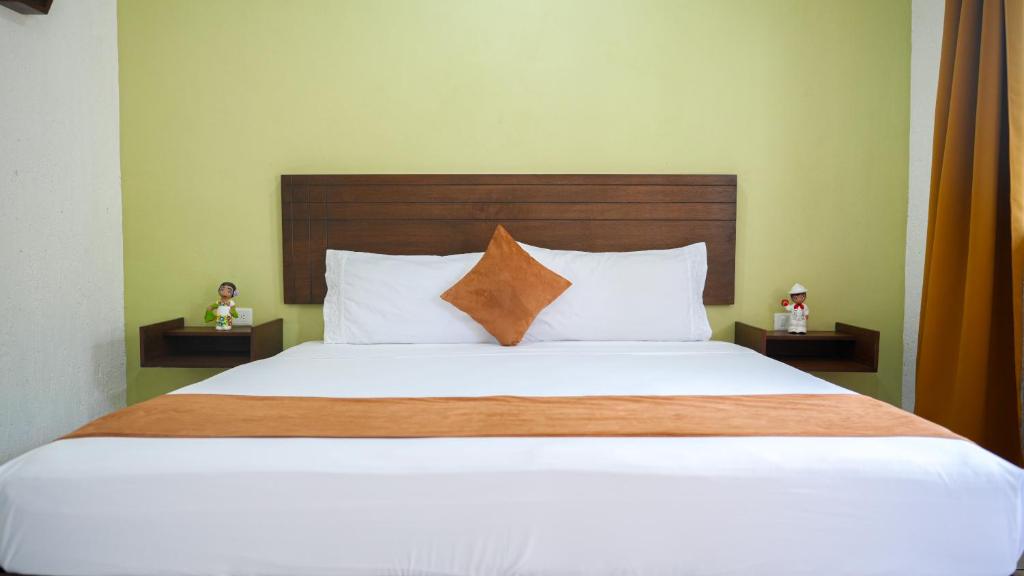 Postel nebo postele na pokoji v ubytování Hotel del Parque