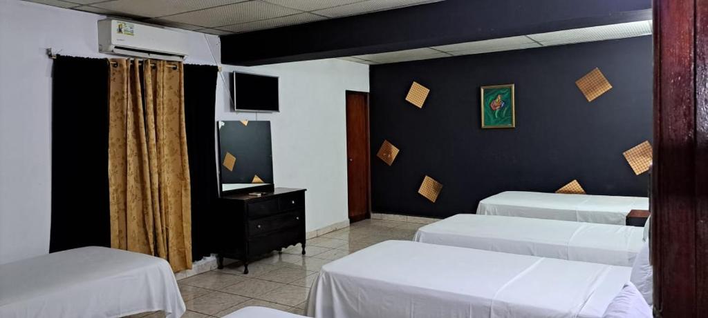 Postel nebo postele na pokoji v ubytování NUEVA ADM- Hotel Occidental