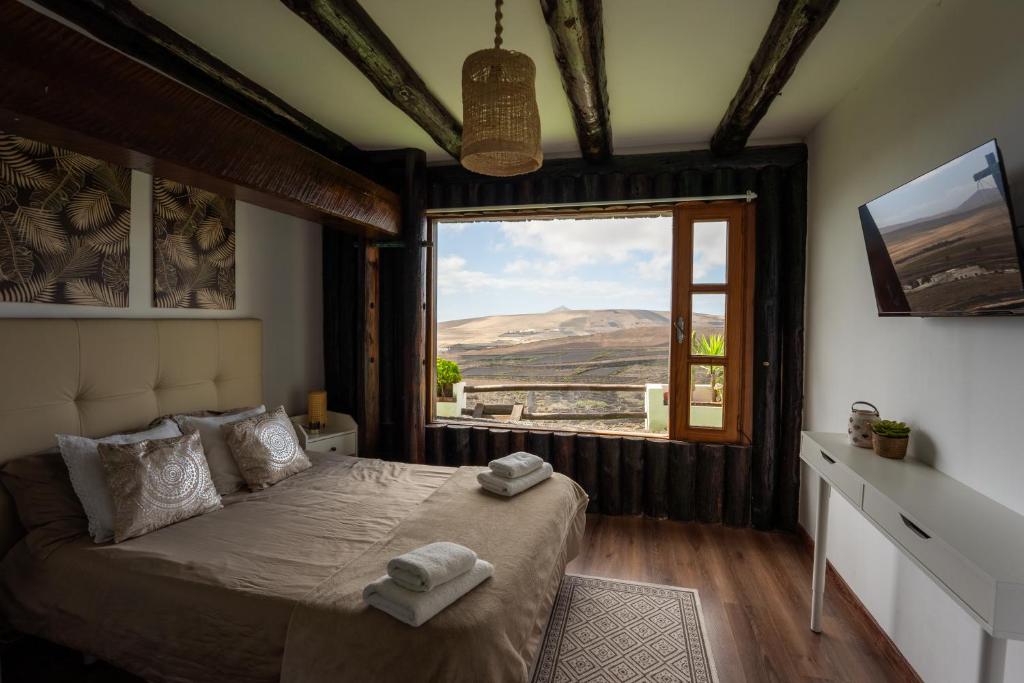 Postel nebo postele na pokoji v ubytování Casona de Tao