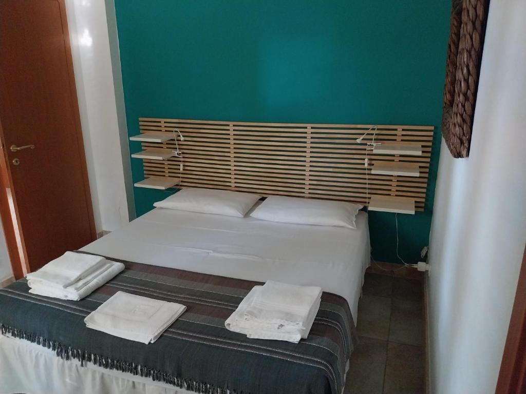 Postel nebo postele na pokoji v ubytování Villa delle palme