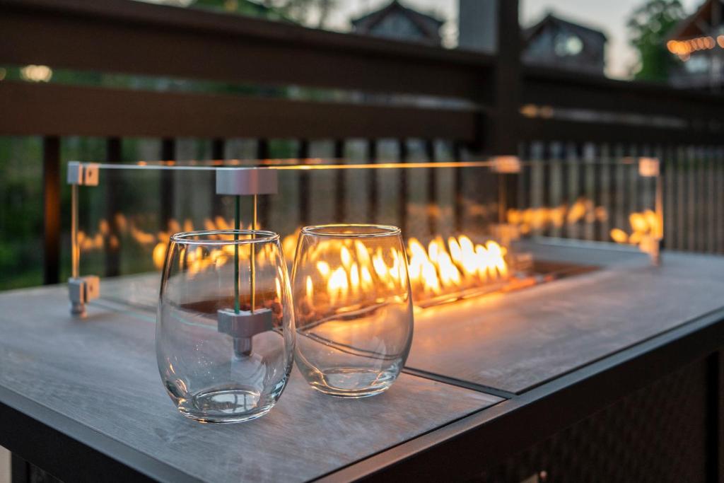 two empty wine glasses sitting on top of a table at Magnolia Pool Lodge in Pigeon Forge