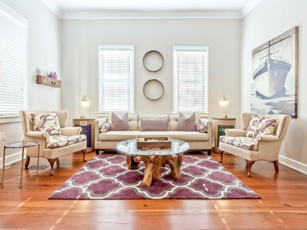 a living room with a couch and a coffee table at Habersham 2 in Savannah