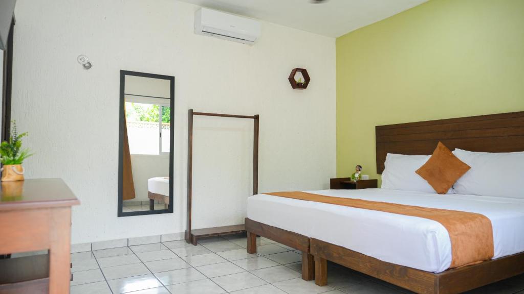 Postel nebo postele na pokoji v ubytování Hotel del Parque