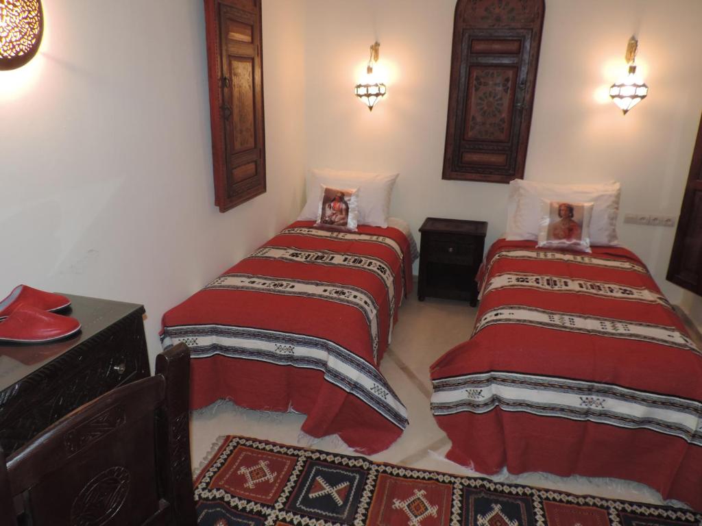 Postel nebo postele na pokoji v ubytování Riad Nirvana