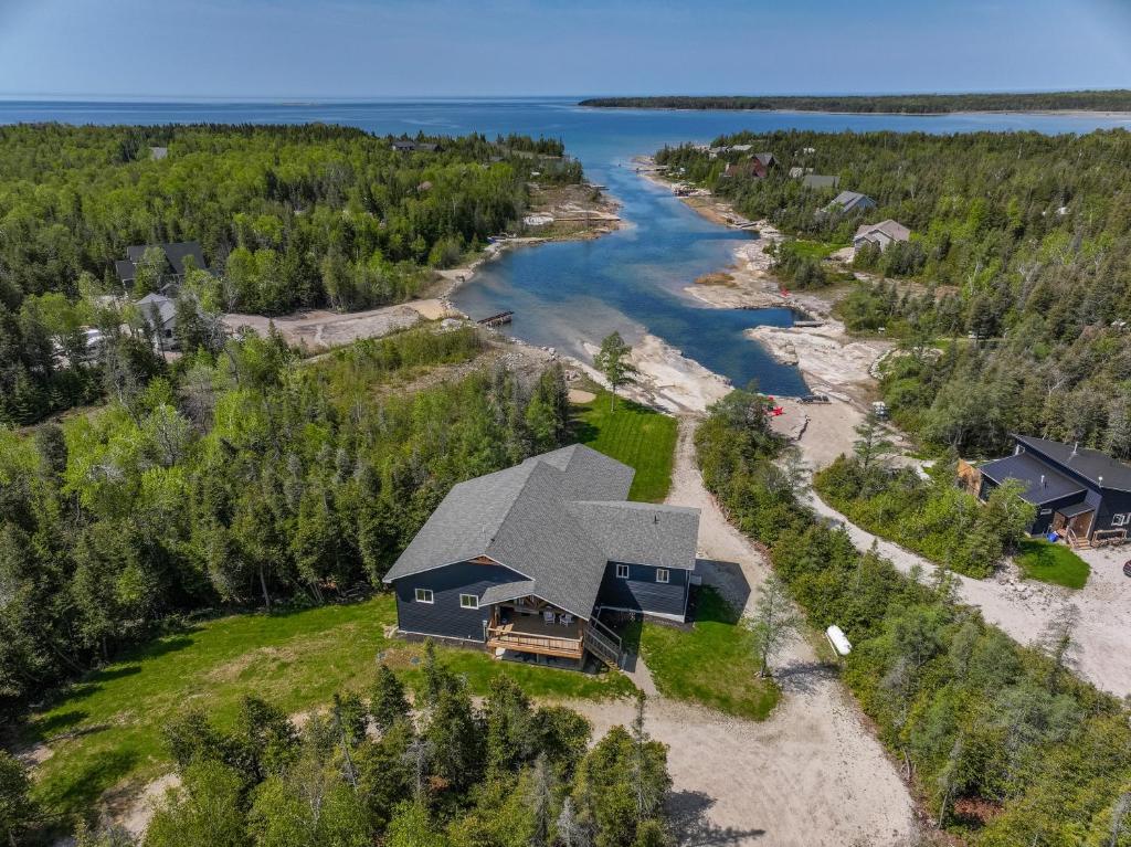 an aerial view of a house on the shore of a river at Luxury Lakefront Escape W Games Room in Stokes Bay