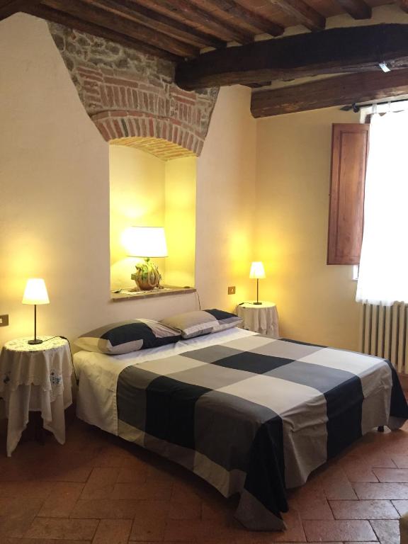 Postel nebo postele na pokoji v ubytování Locanda Petrella