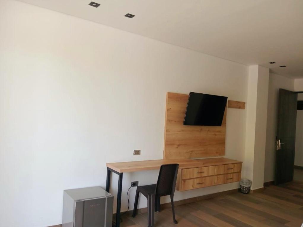 TV a/nebo společenská místnost v ubytování Hotel Monte Bello