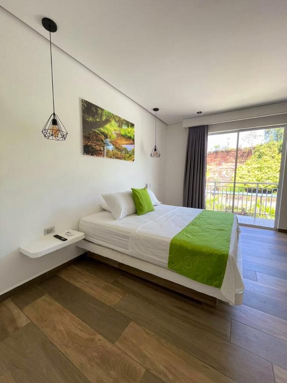 Postel nebo postele na pokoji v ubytování Hotel Monte Bello