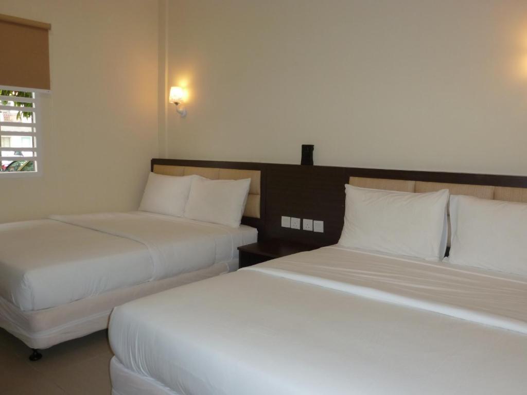 Postel nebo postele na pokoji v ubytování Hotel Hong