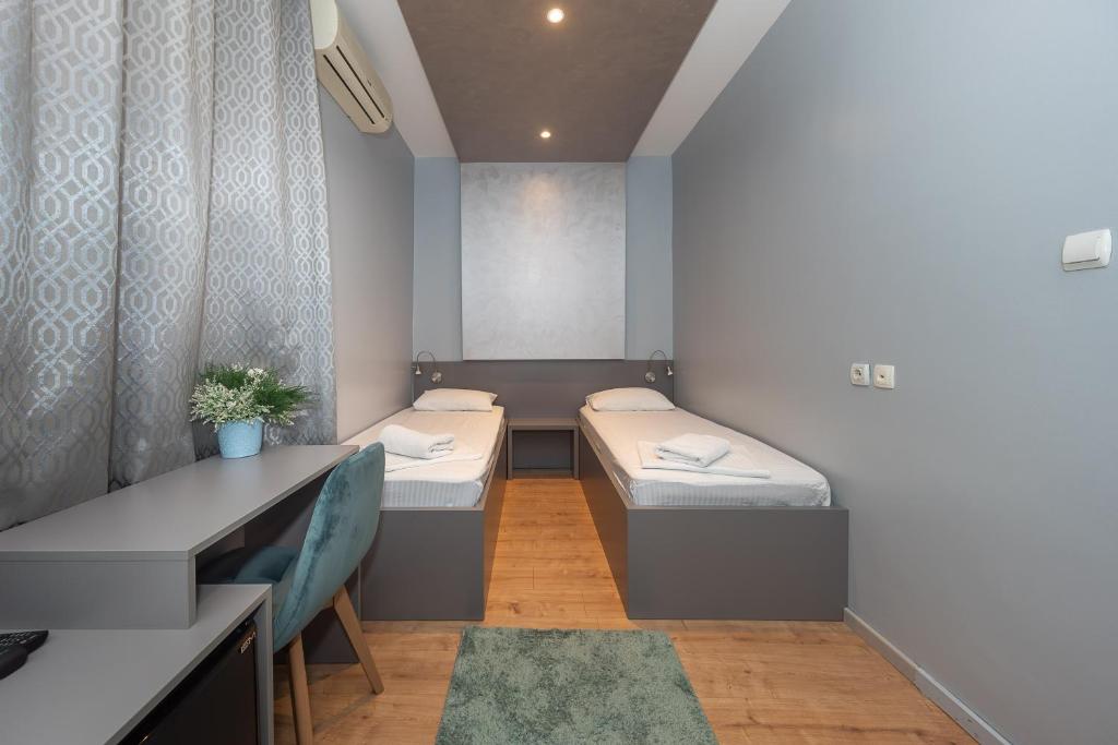 Letto o letti in una camera di Garni Hotel Mediteraneo